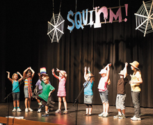 Children in kids summer theater camp act out